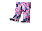Kinder-Skihose mit buntem Blumenmuster und schwarzen Schneeschuhen.