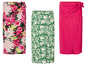 Drei Wickelröcke: einer mit Blumenmuster, einer mit grünen Blättern und einer einfarbiger rosa.