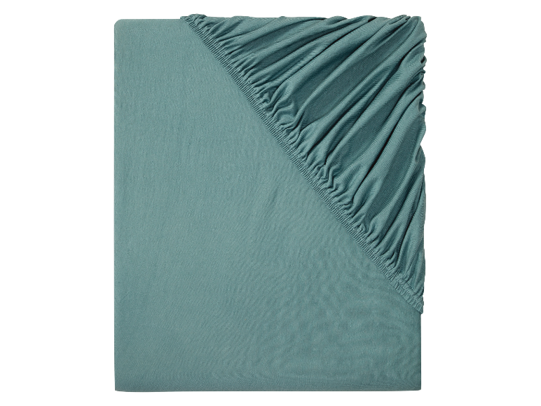 Ein türkisfarbenes, einfarbiges Spannbettlaken