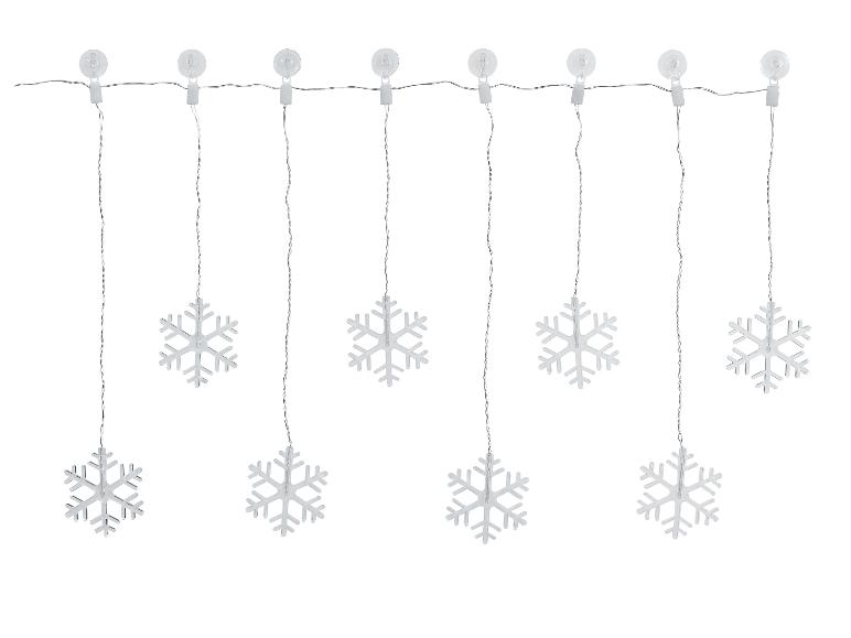 Lichterkette mit acht silbernen Schneeflocken, die an Saugnäpfen hängen.