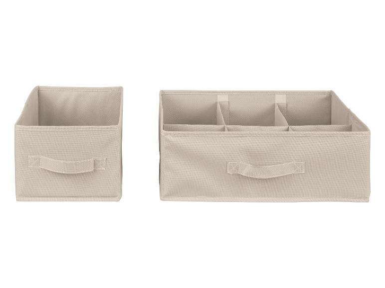 Zwei beige Aufbewahrungsboxen, eine mit Fächern für Kleidung
