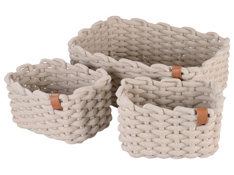 Drei cremefarbene geflochtene Seil-Aufbewahrungskörbe mit braunen Ledergriffen.