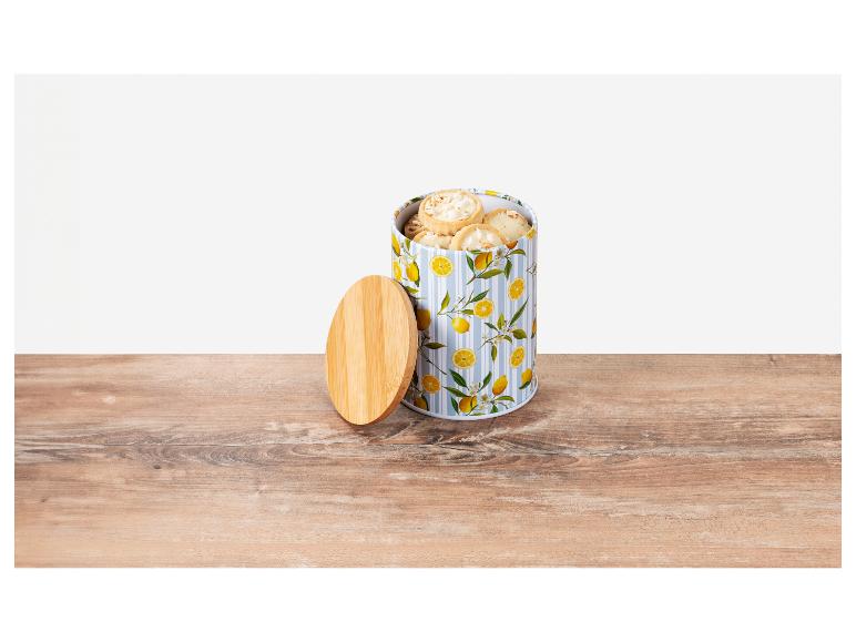 Kekse in einer Dose mit Zitronenmotiv.