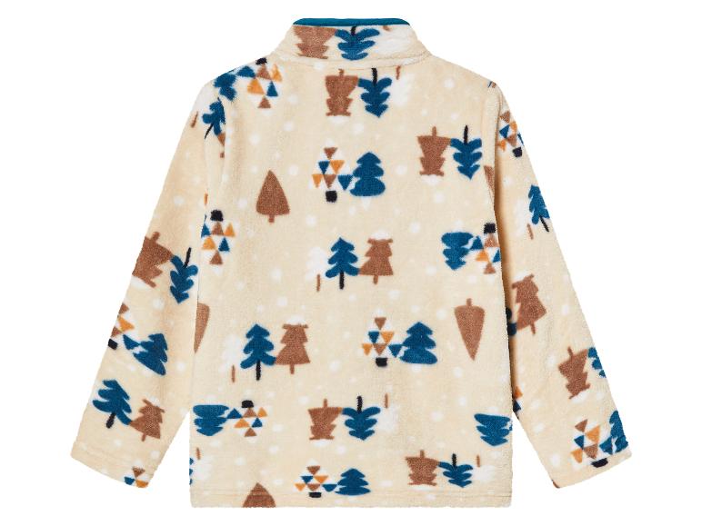 Eine cremefarbene Fleecejacke mit Baum-Muster.