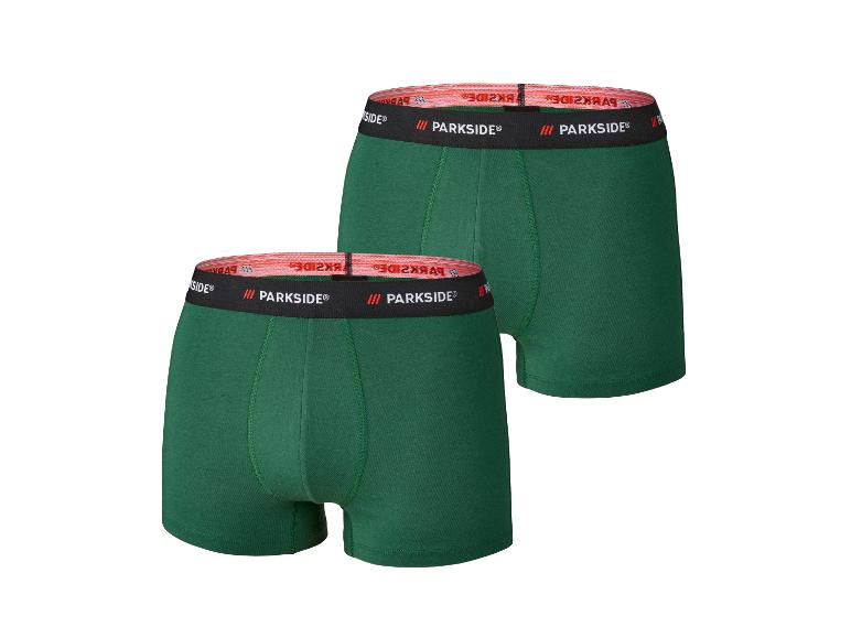 Zwei grüne Parkside Boxershorts mit schwarzem und rotem Bund.
