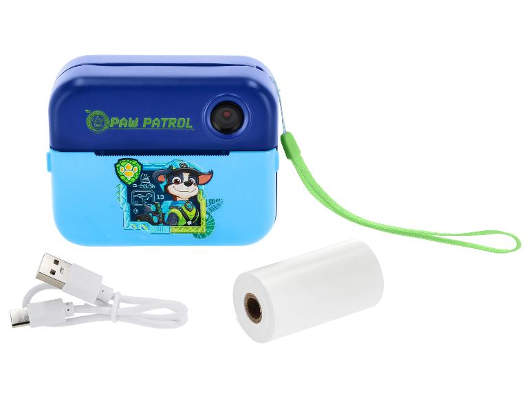 Blaue und türkise Kinder-Sofortbildkamera mit einer Papierrolle und einem USB-Kabel.