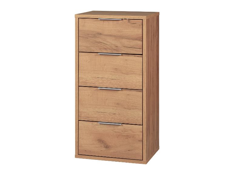 Eine Kommode aus Holz mit vier Schubladen.
