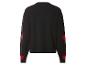 Schwarzer Pullover mit roten Herzen an den Ärmeln, Rückansicht.