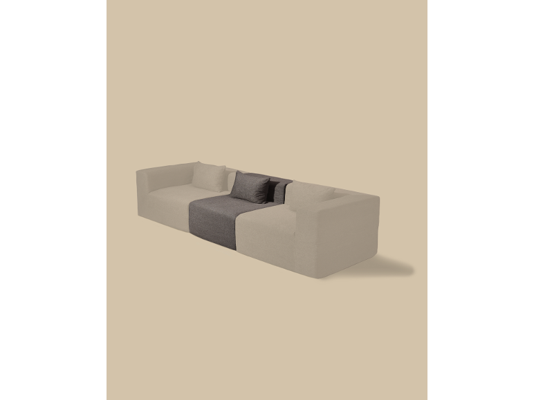 Modulares Sofa mit hellbeigen und dunkelgrauen Abschnitten und Kissen.