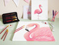Ein Pinselset, Farbe und zwei Leinwände mit Flamingos.