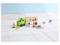 Peppa Pig Holzspielzeug mit LKW, Anhänger und Formensortierer auf einem weißen Holzboden.