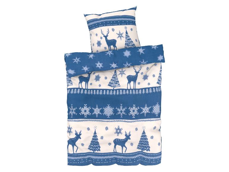 Ein blauer Bettbezug mit Rentieren und Schneeflocken.