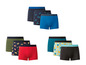Ein Set aus sechs Boxershorts in verschiedenen Farben und Mustern, darunter Ananas, Zitrusfrüchte und Vögel.