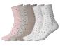 Fünf Paar Damen-Socken mit Herz- und Punktmustern in verschiedenen Farben.