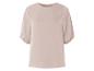 Ein hellbeiges Oberteil mit kurzen Ärmeln.