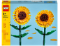 Spielzeug-Sonnenblumen mit gelben Blütenblättern und grünen Stielen, mit Produktverpackung.