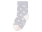 Graue Socke mit weißen Punkten.