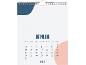 Wandkalender mit Januar 2027 Layout, mit blauen und pfirsichfarbenen Akzenten.