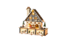 Dekoratives Weihnachts-Holzhaus mit LED-Beleuchtung.
