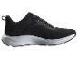 Schwarze Sportschuhe mit orangefarbenen Details und weißer Sohle