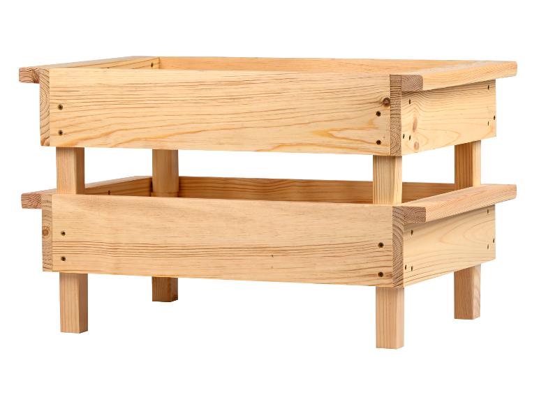 Holzaufbewahrungsbox mit vier Beinen, aus hellem Holz gefertigt.