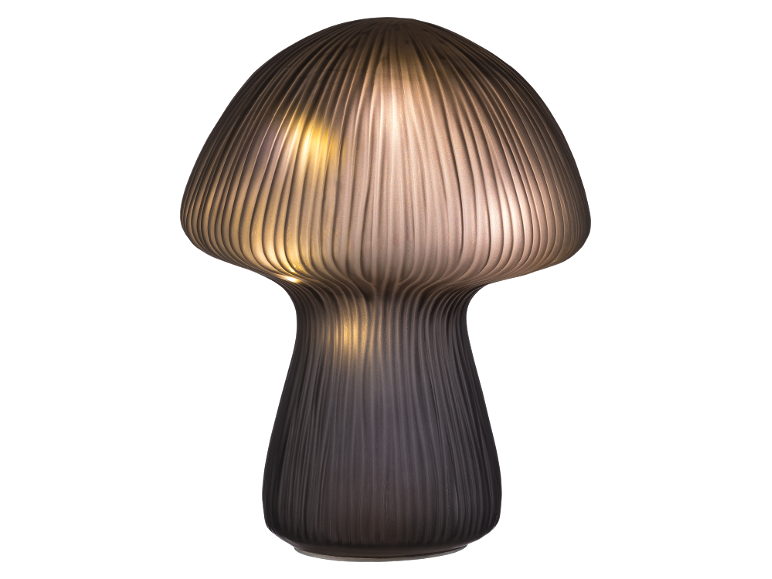 Dekorative Tischleuchte in Pilzform mit geriffeltem Glas und warmem Licht.