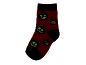 Rote Socke mit im Dunkeln leuchtendem Halloween-Kürbismuster.