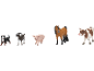 Spielzeugfiguren von Hund, Ziege, Schwein, Pferd und Kuh.