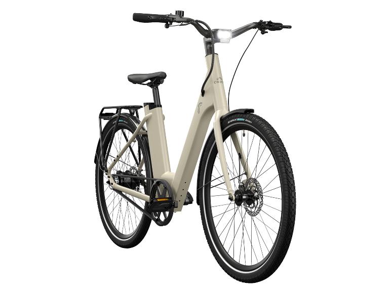 Ein beiges E-Bike mit Schwalbe Reifen.
