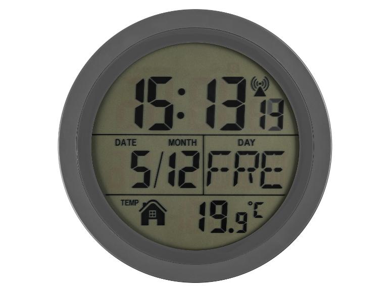 Digitale Uhr mit Anzeige von Uhrzeit, Datum, Tag und Innentemperatur von 19,9°C.