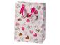 Weiße Geschenktüte mit rosa und braunem Herzmuster, mit rosa Schleifengriff.