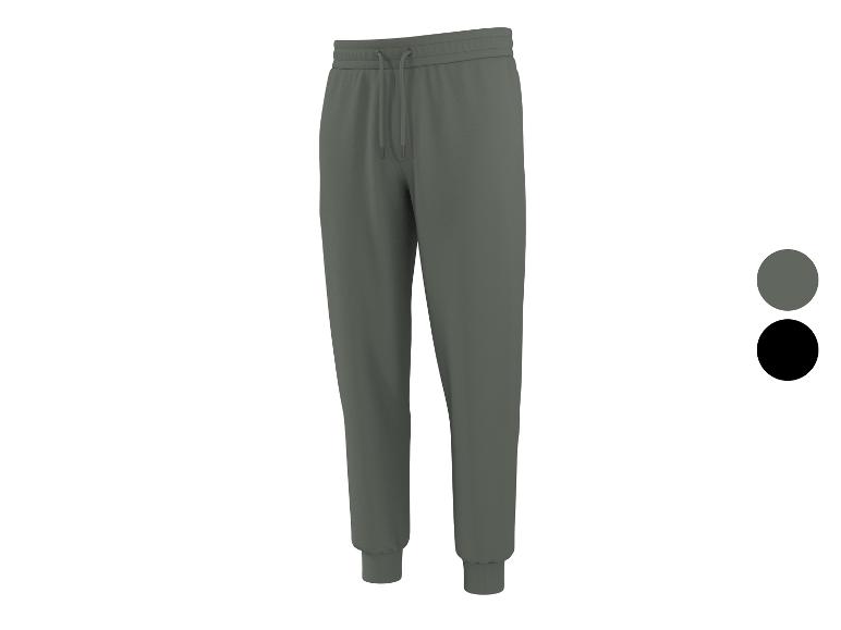 Graue Jogginghose mit Kordelzug und Bündchen, mit Farbproben in Grau und Schwarz.