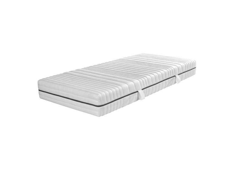 Eine weiße Matratze mit einem gestreiften Design.