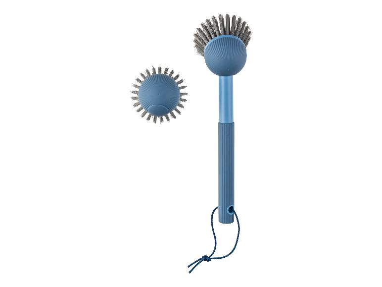 Ein blauer Spülbürste mit Stiel und eine zusätzliche Spülbürste