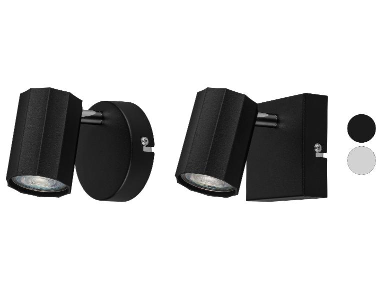 Moderne Wandleuchten in Schwarz und Grau.