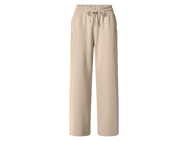 Beige weite Jogginghose mit Kordelzug in der Taille.