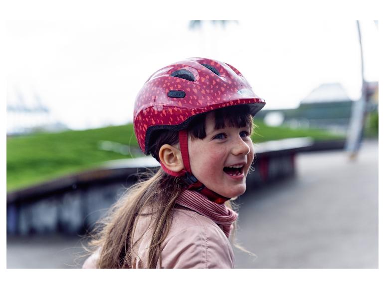 Abus Kinderfahrradhelm, Herzchenmuster, rosa.