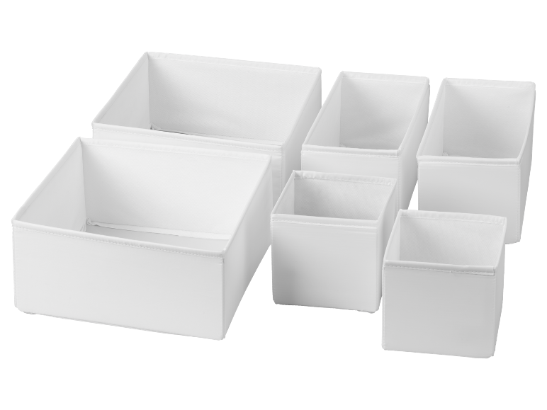 Set aus weißen Stoff-Aufbewahrungsboxen und Schubladenorganisatoren in verschiedenen Größen.