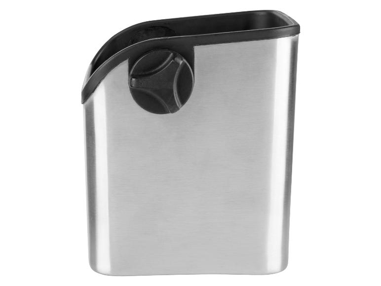 Eine metallene Aufbewahrungsbox mit einem schwarzen Knopf.