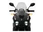 Schwarzes Motorrad mit Windschutzscheibe und hellen LED-Scheinwerfern.