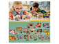 Kinder spielen mit verschiedenen LEGO-Sets, darunter Fabuland, Ninjago und LEGO Classic.