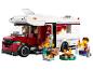 LEGO City Set mit Wohnmobil, Minifiguren und Lagerfeuer.