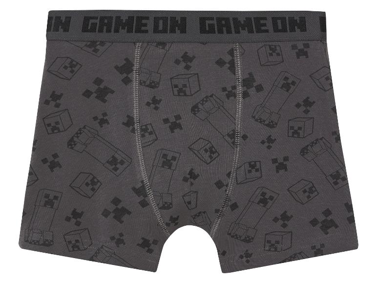 Graue Minecraft Boxershorts mit Creeper- und Pixelmotiven.