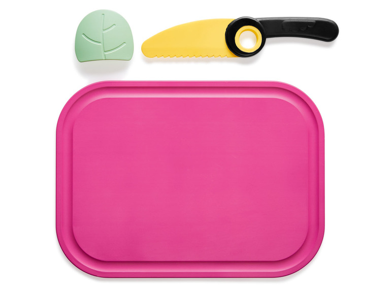 Ein rosa Schneidebrett, ein gelbes Messer und ein grünes Blatt.