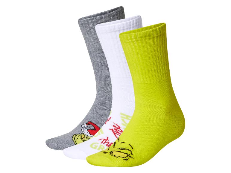Dreierpack Grinch-Socken: grau, weiß und neongrün.