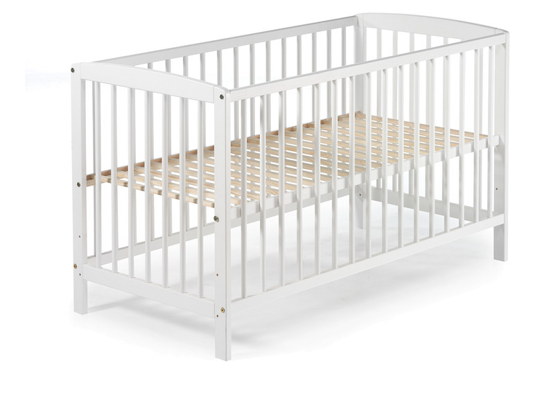 Weißes Babybett aus Holz mit Gitter
