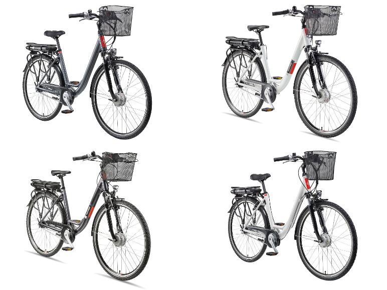 Vier E-Bikes mit Körben, zwei graue und zwei weiße.