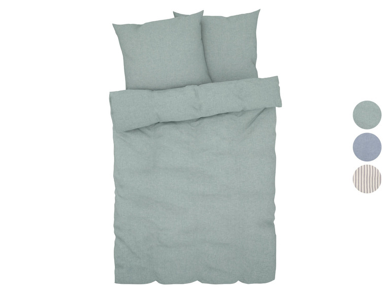 Ein hellgrünes Bettbezug-Set mit passenden Kissenbezügen.