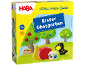Kinderspiel mit Holzfiguren von Früchten und einem Raben