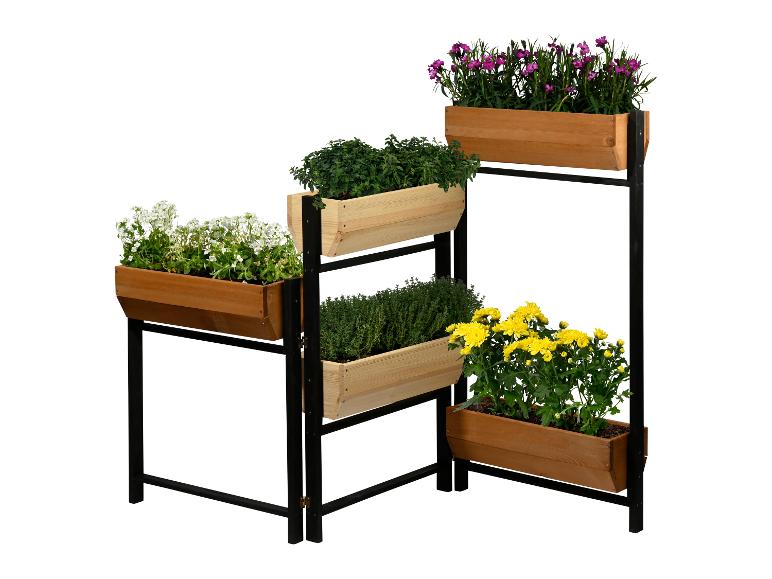 Gestuftes Holzhochbeet mit verschiedenen Blumen und Kräutern auf schwarzem Metallgestell.